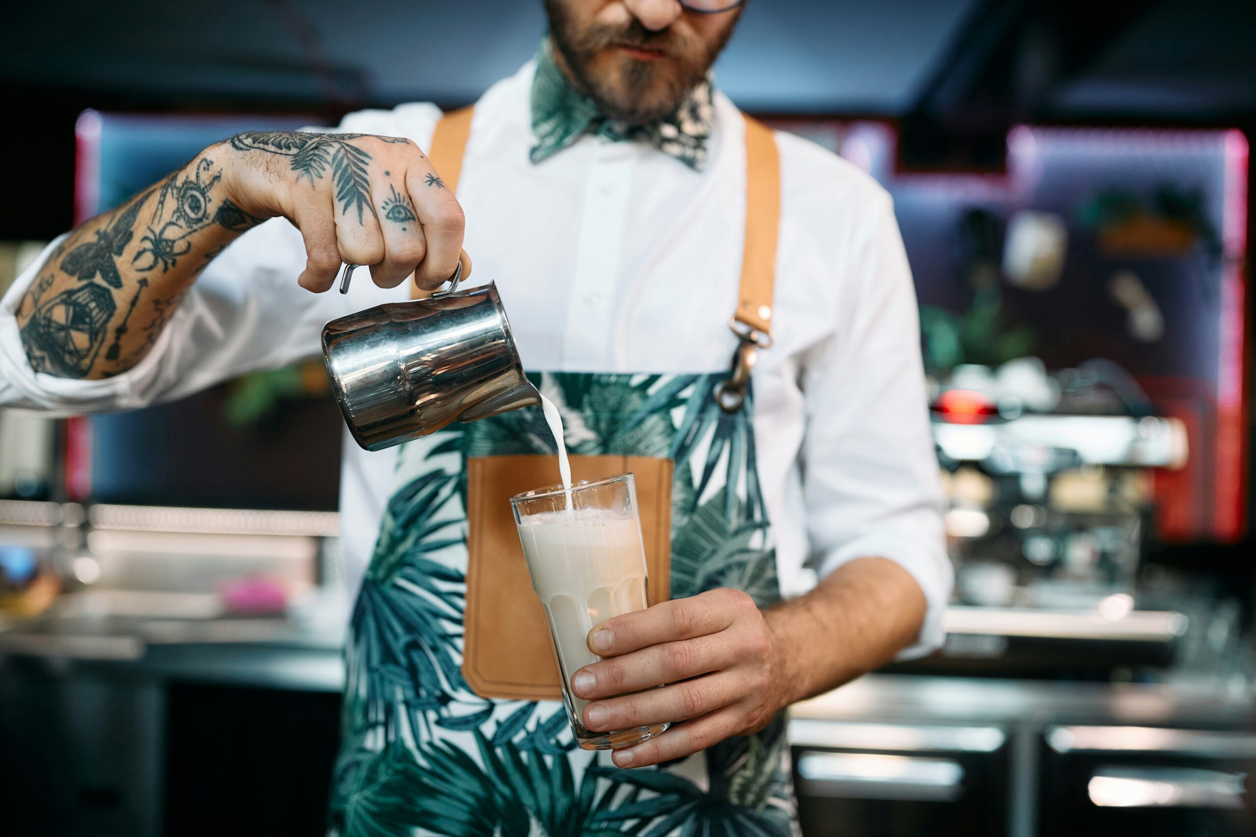Barista pours up a cold coffee